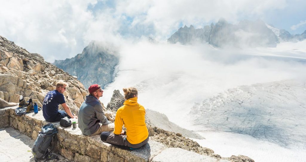 Mountaineers relaxing with a view of a Swiss glacier