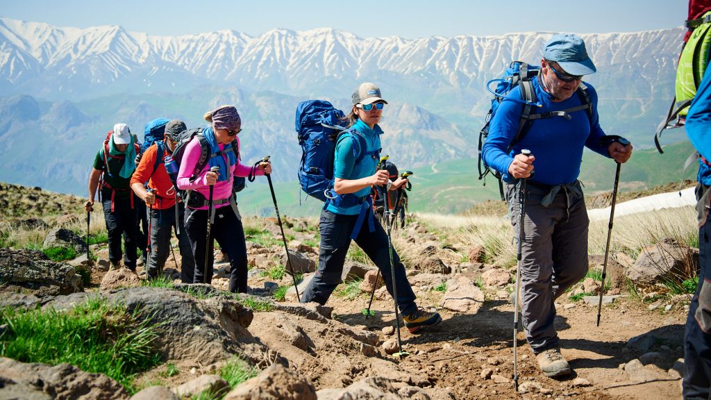 Group of mountaineers hiking up to Mount Damavand high camp
