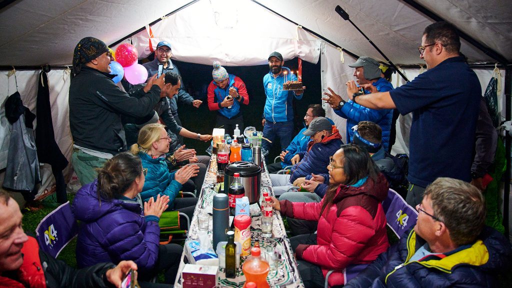 Climbers celebrating a birthday in a tent in Iran's Dar valley
