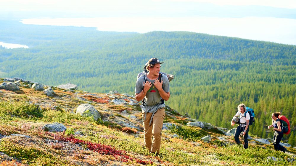 Young male hiking on a hill in Norway
