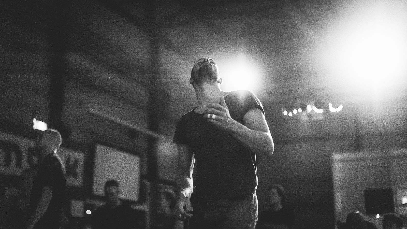 Climber working the beta for a boulder problem