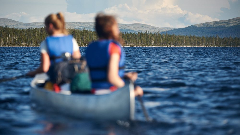 View of a lake with a canoe out of focus in Norway