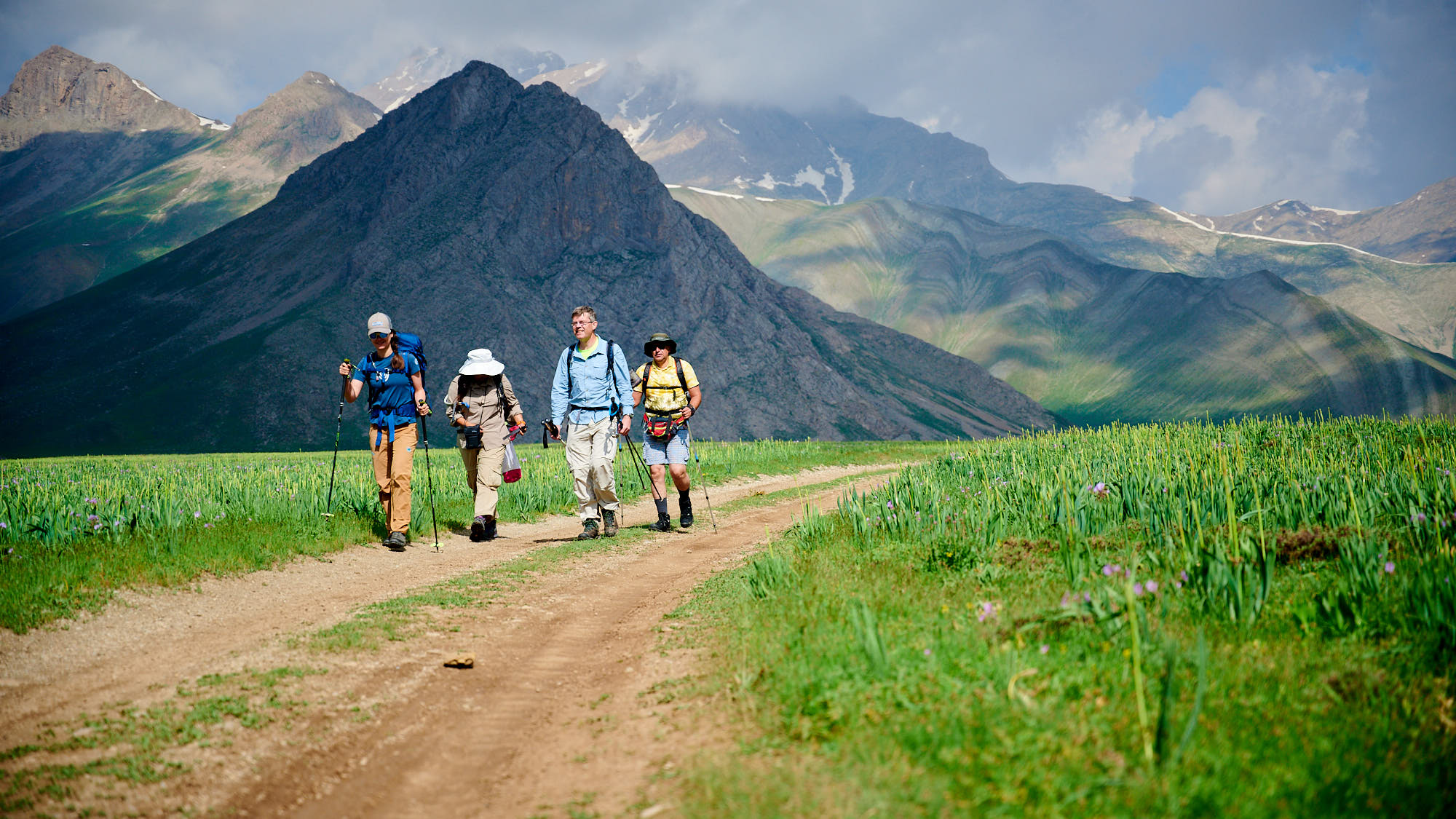 Group of hikers on a gravel road in Dar valley in Iran