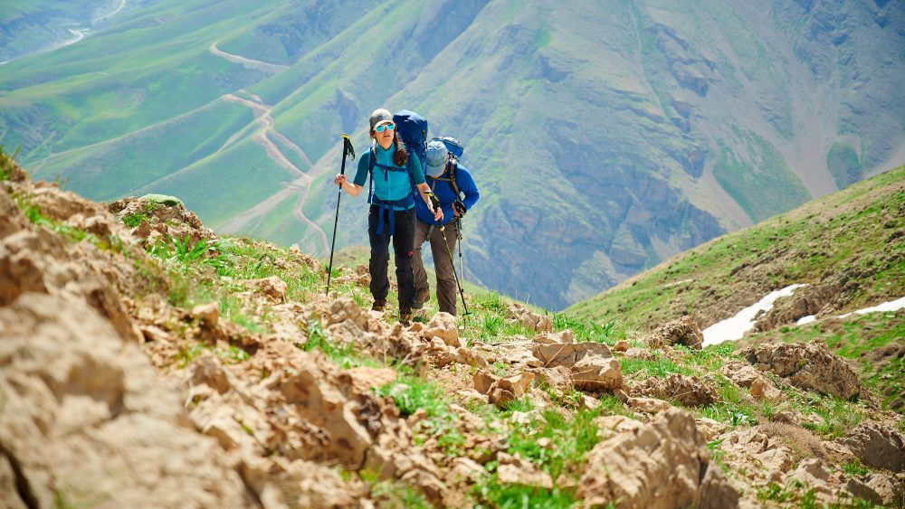 Hikers near Poulor and Mount Damavand in Iran