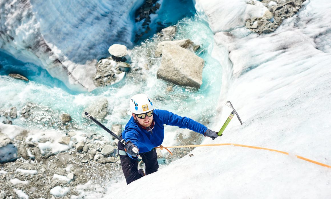 Mountaineer ice climbing on the Mer de Glace glacier