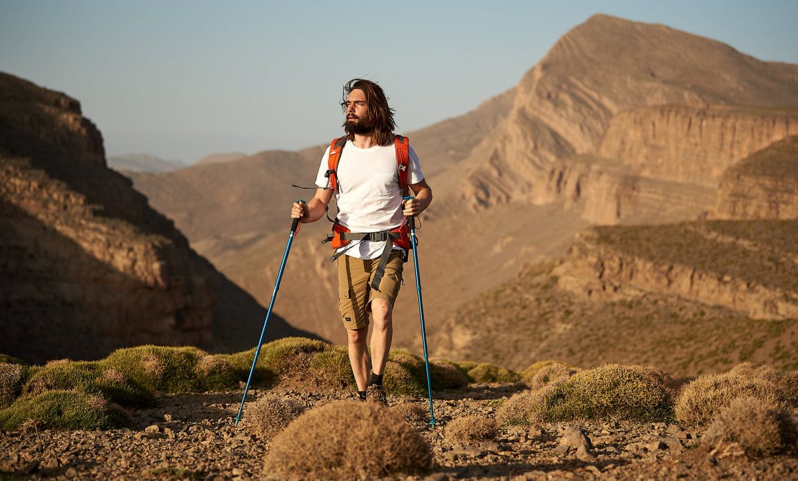 Hiker walking through the Moroccan High Atlas mountain ridge