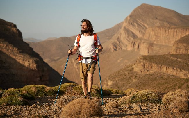 Hiker walking through the Moroccan High Atlas mountain ridge